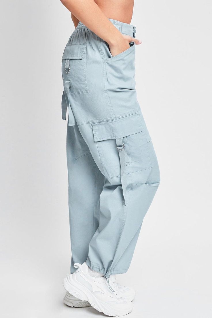 Add style, comfort, and versatility to your pant collection with our women’s elastic waist cargo pants. This relaxed-fit cargo pant is constructed with lightweight cotton fabric for maximum comfort and versatility. Our cargo pants for women have a relaxed leg, baggy fit from hip to hem, and are full-length with a draws Cotton Cargo Jeans In Straight Fit, Cotton Straight Cargo Pants, Relaxed Fit Cargo Parachute Pants Ankle-length, Relaxed Fit Cargo Style Parachute Pants, Relaxed Fit Ankle-length Cargo Parachute Pants, Solid Cotton Utility Cargo Pants, Cotton High-waisted Cargo Pants, Cotton Cargo Pants Ankle-length, Cotton Cargo Style Ankle-length Pants