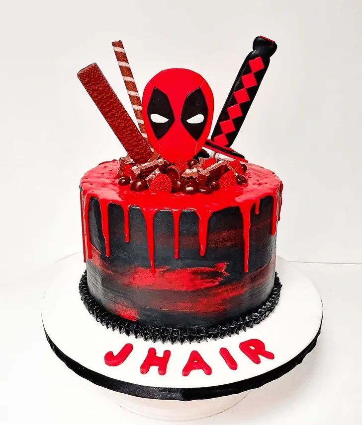 a birthday cake decorated to look like deadpool