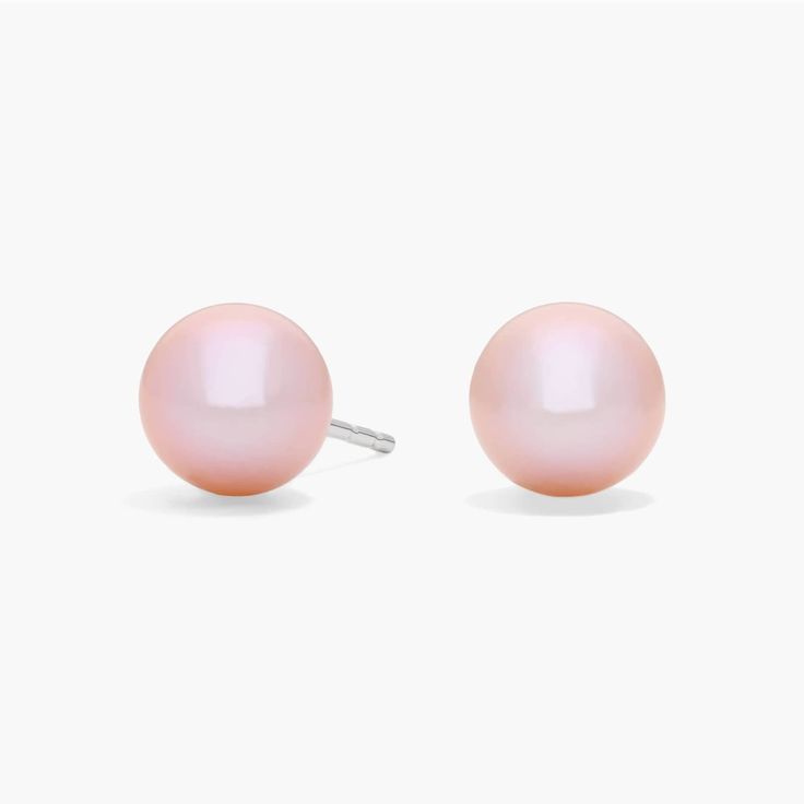 These luminous pink freshwater pearls have an eye-catching color. The earrings are set on 14k white gold posts with friction backs. Pink Round Pearl Earrings For Formal Events, Pink Round Pearl Earrings For Formal Occasions, Pink Pearl Earrings For Anniversary, Classic Pink Pearl Earrings As A Gift, Classic Pink Round Earrings, Cheap Pink Pearl Earrings, Classic Pink Akoya Pearl Jewelry, Delicate Pink Pearl Earrings, Nickel-free White Gold Pearl Earrings