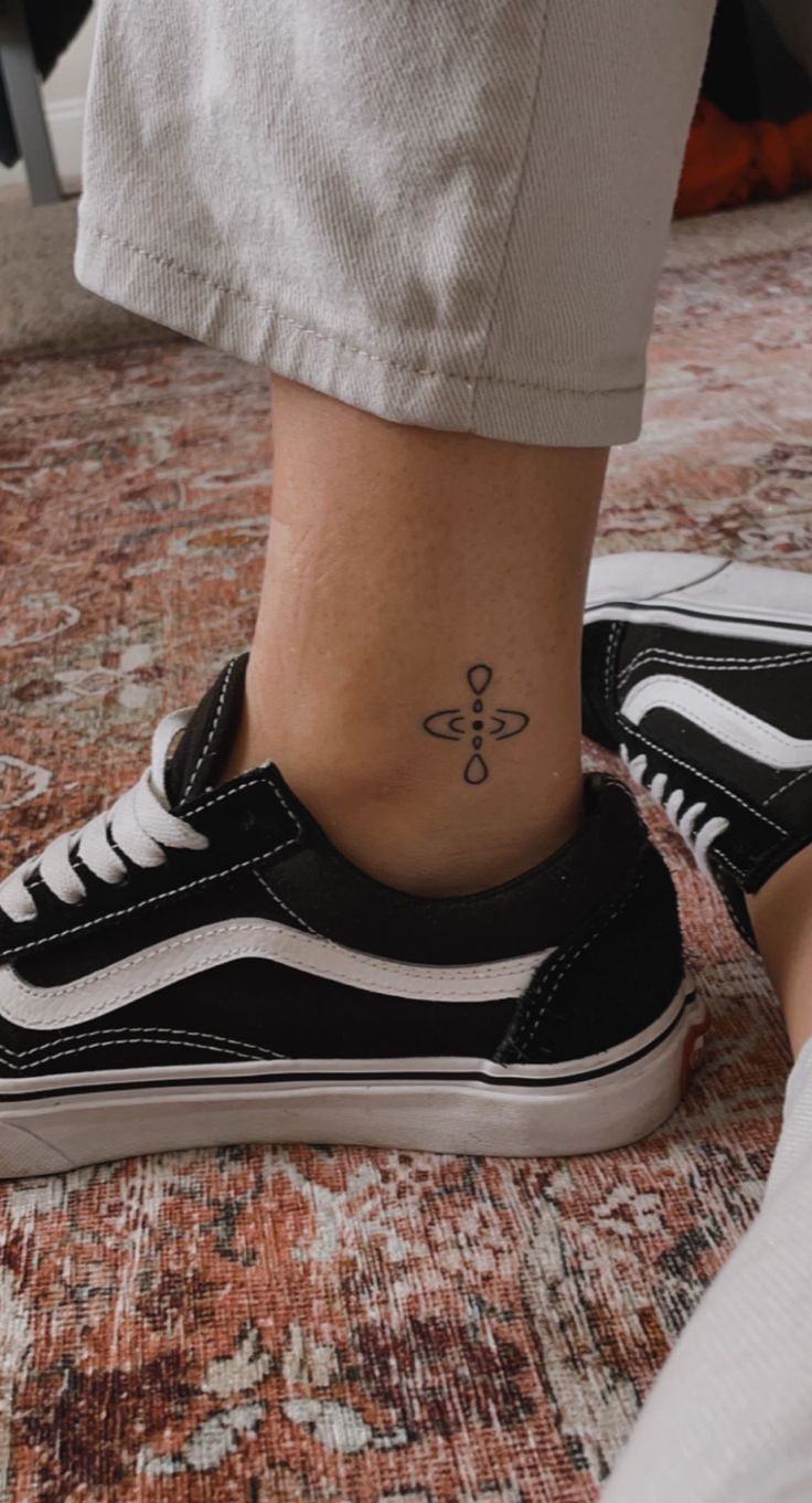 a person with a small tattoo on their foot