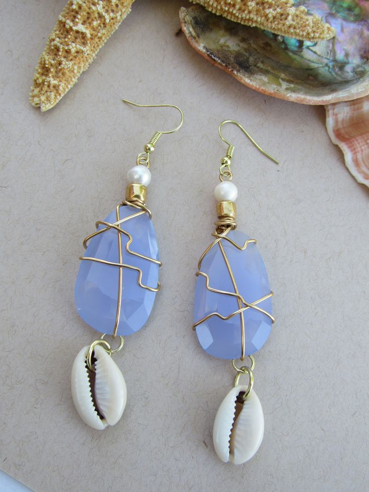 Aqua Chalcedony and freshwater pearl earrings with cowrie shells. Handmade Ocean Color Jewelry For Summer, Handmade Ocean Color Summer Jewelry, Cowrie Shell Dangle Earrings As Gift, Blue Shell-shaped Handmade Jewelry, Handmade Cowrie Shell Earrings As Gift, Handmade Cowrie Shell Earrings For Gift, Handmade Blue Shell Jewelry, Handmade Blue Mother Of Pearl Jewelry, Ocean-inspired Blue Shell Jewelry