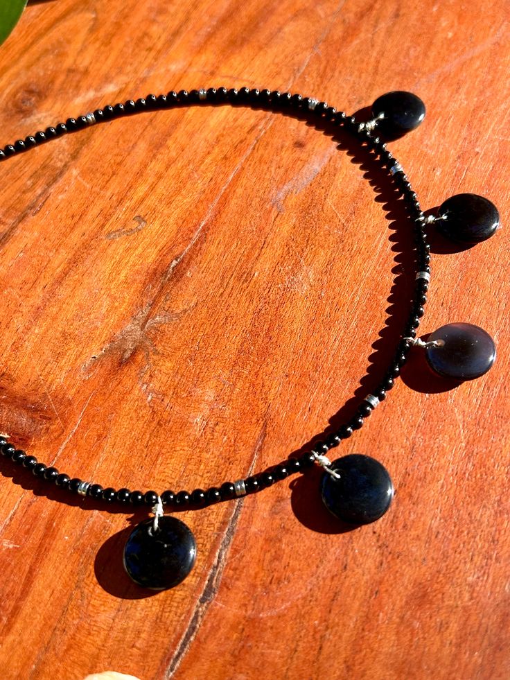 Beaded black onyx & black agate discs choker necklace with barrel twist clasp Matching black onyx & black agate sterling silver earrings Black Onyx Jewelry With Black Beads, Black Gemstone Round Beads Jewelry, Black Gemstone Beads Jewelry, Black Onyx Beads Jewelry, Black Onyx Jewelry With Polished Beads, Round Onyx Bead Jewelry, Onyx Round Beads Jewelry, Round Onyx Gemstone Beads Jewelry, Black Jewelry With Natural Stone Round Beads