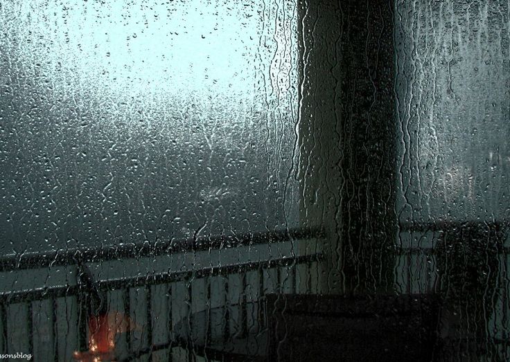 the rain is falling down on the window and it looks like they are in the dark