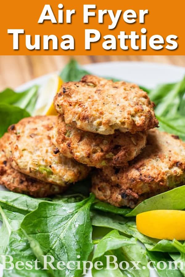 the cover of air fryer tuna patties on a plate with spinach leaves