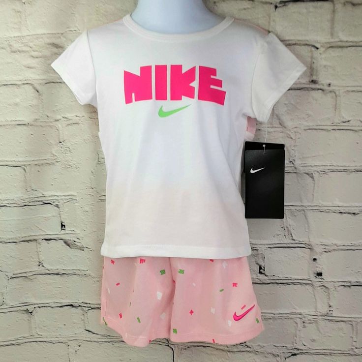 Nike 2-Piece Outfit By : Nike A Two Piece Set With The "Nike" Slogan, And Signature "Nike" Swoosh Sign That Will Give Your Little One A Adorable Athletic Style. The Shirt Features A Soft Upper Mesh Backing With Peekaboo Cutouts To Add More Charm To This Outfit. The Mesh Shorts Match Perfectly With The Mesh Backing On The Shirt .A Fashionable, Cool, And Comfy Set That You, And Baby Will Love. Two Piece Set Includes: ~ Top ~ Shorts Embroidery Detailing Mesh Backing Peekaboo Cutout Back Material: ~ Nike Girl Outfits, Kids Athletic Wear, Shorts Embroidery, Nike Onesie, Nike Sweatsuit, Baby Boy Nike, Neon Shorts, Nike Outfit