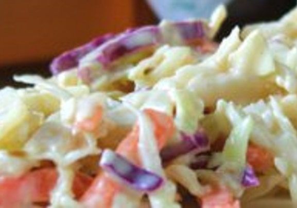 a pile of coleslaw sitting on top of a table