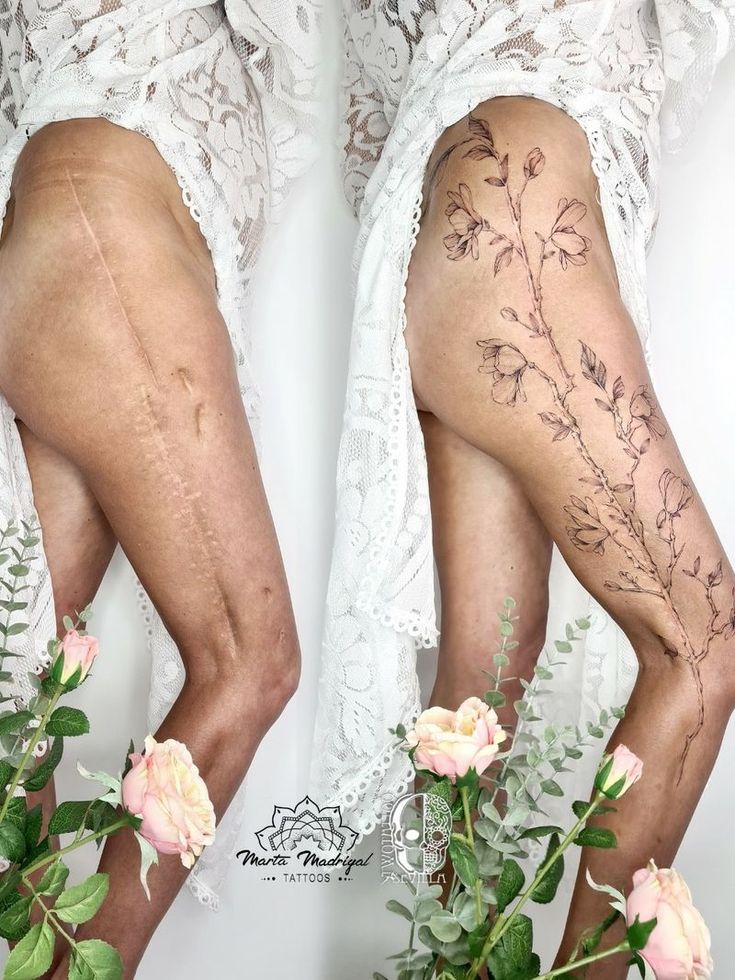 a woman with tattoos on her legs standing next to flowers