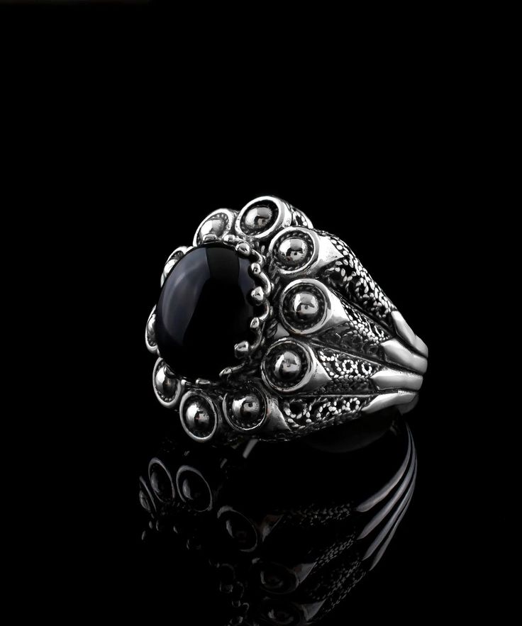 Experience the beauty of handcrafted jewelry with this exquisite embroidery ring. Made with the highest quality materials, the 925 sterling silver band is designed with filigree art and oxidized for an antique look. The 10x12 mm cabochon oval cut Black Onyx gemstone is set in a bezel setting, adding a touch of luxury and sophistication to any outfit. Measuring 0.9 inches / 22.50 mm in length and 0.80 inches / 20.00 mm in width, this ring features intricate filigree details that showcase the arti Ornate Ring, The Ring Face, Oxidized Silver Rings, Black Stone Ring, Filigree Jewelry, Gothic Rings, Sparkling Rings, Onyx Gemstone, Sterling Silver Filigree