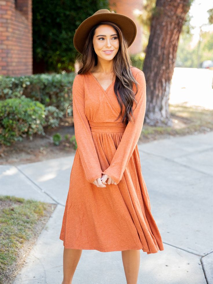 Introducing the stunning Isla Dress - the ultimate must-have for your fall/winter wardrobe! This dress effortlessly combines style and comfort, making it the perfect choice for any occasion. Size: Small 0-4 Medium 6-8 Large 10-12 XL 12-14 Fall Long Sleeve Solid Color Midi Dress, Brown Solid Color Midi Dress For Fall, Fall Orange V-neck Midi Dress, Casual Orange Dresses For Fall, Orange Long Sleeve Fall Dress, Casual Brown Midi Dress For Fall, Orange Casual Winter Dress, Casual Orange Winter Dress, Modest Long Sleeve Fall Dress