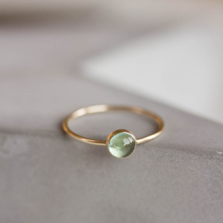 This Tiny skinny stackable ring with beautiful sky blue Apatite is an outstanding piece in minimalist style. It is made with a skinny but sturdy band, perfect for everyday wear. The ring is 0,8-0,9 mm thick and looks very dainty on the finger. Choose the stone cut and size and material for the ring (sterling silver or 9k gold). If you want to change the ring band design or get a custom ring or ring sets, feel free to contact me. You can order a ring of any size. There is a personalization field, Minimalist Topaz Gemstone Ring For Everyday Wear, Minimalist Topaz Ring For Everyday, Minimalist Everyday Topaz Ring, Minimalist Everyday Blue Topaz Jewelry, Minimalist 14k Gold Topaz Ring, Apatite Ring, Band Design, Custom Ring, Blue Apatite