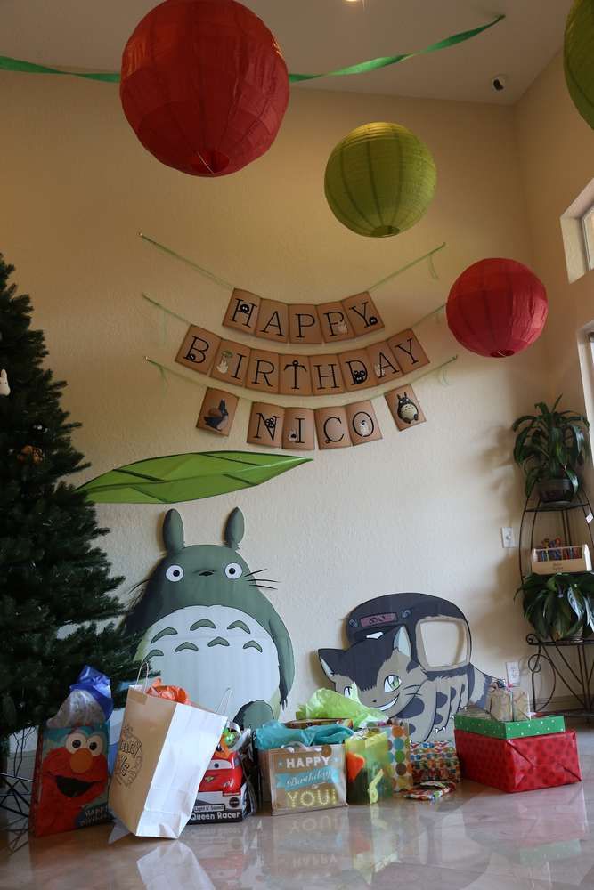 a birthday party with decorations and presents on the table