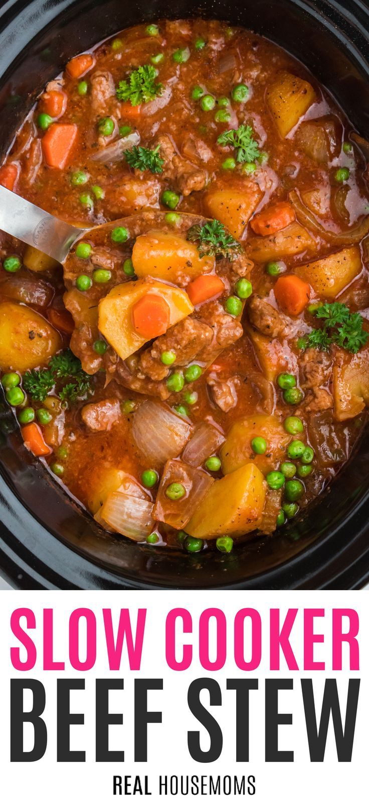 slow cooker beef stew in a crock pot with peas and carrots on the side