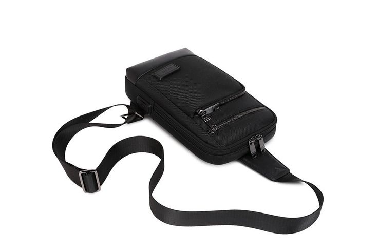 DESCRIPTION: For the Professional. For the Urban Adventurer. For the Traveler. Sophisticated and well-executed, our Pro Crossbody Vegan Sling Bag was made for those on the go! FEATURES: High quality 1680D polyester exterior. High density polyester lining. Multiple exterior pockets. Multiple interior pockets. No leather or animal products used (cruelty free sling bag!). PETA-Approved Vegan Sling Bag. SIZE: 11.8 x 6.7 x 2.8 inches (30 x 17 x 7 CM), 1.2 lbs. Versatile Travel Chest Bag With Single Shoulder Strap, Functional Nylon Shoulder Bag For Evening, Versatile Chest Bag With Single Shoulder Strap For Travel, Modern Nylon Bag For Formal Occasions, Elegant Nylon Shoulder Bag With Zipper Closure, Business Nylon Shoulder Bag With Adjustable Strap, Business Shoulder Bag With Adjustable Strap In Nylon, Versatile Nylon Shoulder Bag For Business, Elegant Nylon Bag With Adjustable Strap