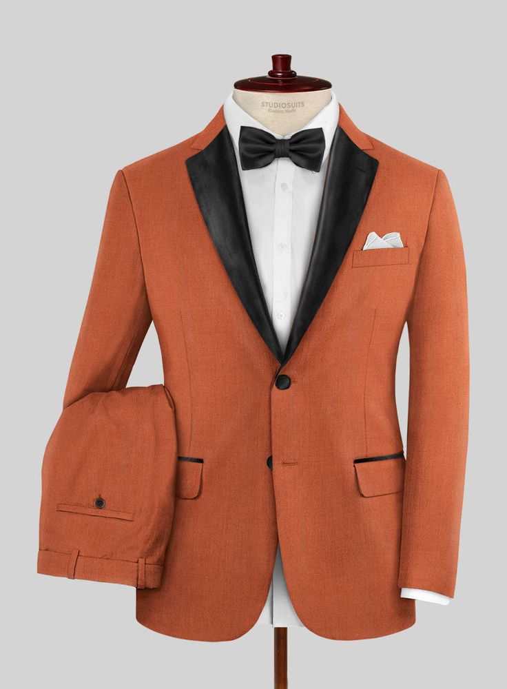 Boost your aesthetic fashion sense with our Napolean Runway Orange Wool Tuxedo Suit that assures to give a unique twist to your wardrobe this season. Crafted with wool blend, our suit has a dashing orange color that augments your confidence with high praise and promises to be quite elegant and stylish. So rewrite new rules to update your fashion sense and be the one to embrace this sophisticated style for a long time.   Featuring satin lapel, matching satin covered buttons and gentle texture at Designer Single Button Fitted Suit, Designer Fitted Single Button Suit, Tailored Silk Suits For Fall, Formal Single Breasted Sets For Fall, Tailored Formal Winter Sets, Designer Fitted Single Breasted Tuxedo, Formal Winter Suiting Fabric Sets, Fitted Suits For Fall, Formal Fall Sets With Notch Lapel