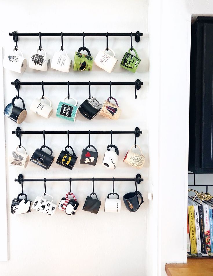 coffee mugs hanging on a wall display with the words coffee mug wall display above them