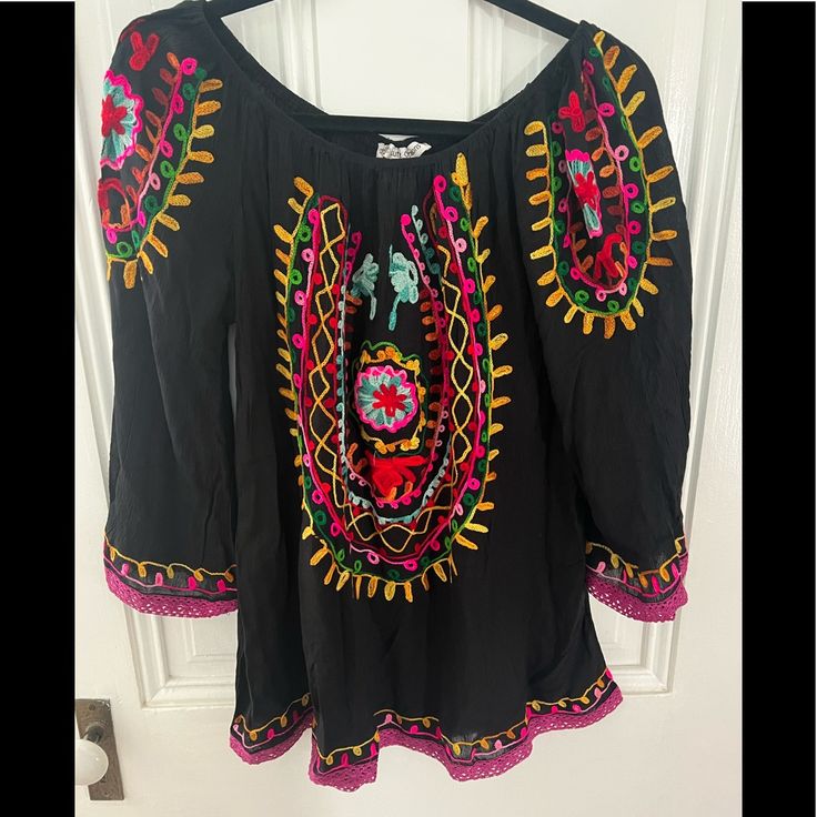 Boho And Be Admired As A Travelor Free People Esq Bright Embroidered Top Magenta Accented Lace At The Hem Black Embroidered Summer Blouse, Black Embroidered Long Sleeve Top For Summer, Black Long Sleeve Embroidered Top For Summer, Black Embroidered Top For Summer Festival, Black Long Sleeve Embroidered Top, Black Cotton Top With Geometric Embroidery, Black Floral Embroidered Blouse For The Beach, Black Fitted Bohemian Embroidered Top, Fitted Black Bohemian Embroidered Top