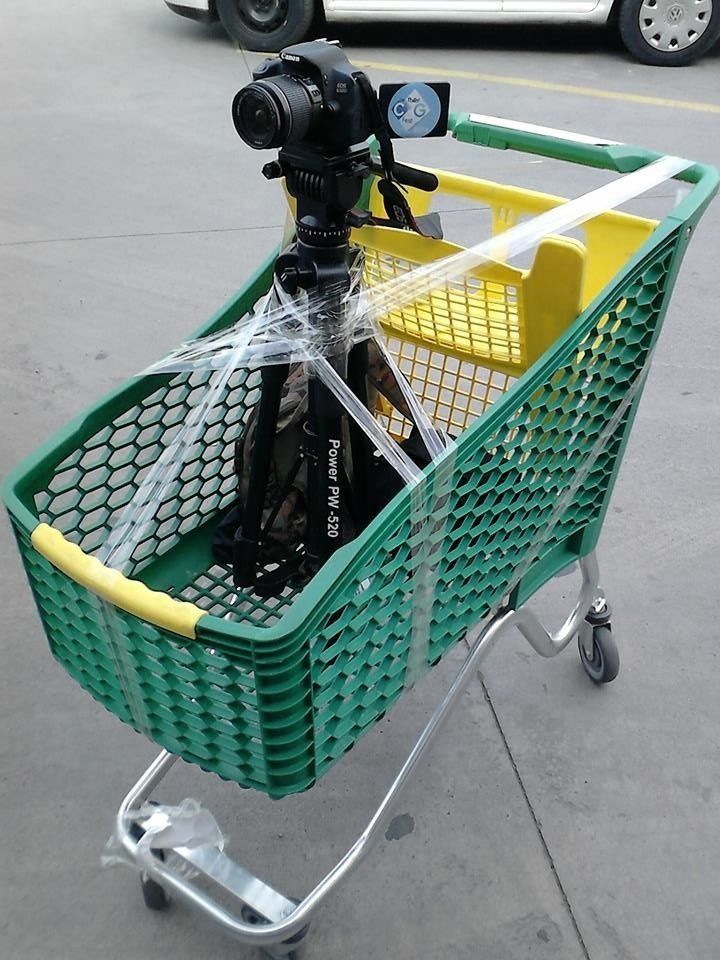 a video camera sitting on top of a shopping cart