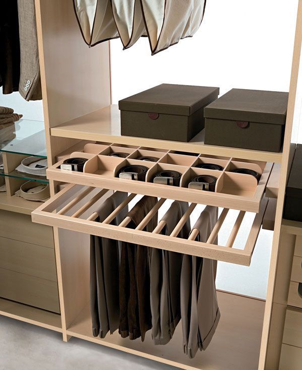 an organized closet with clothes and shoes