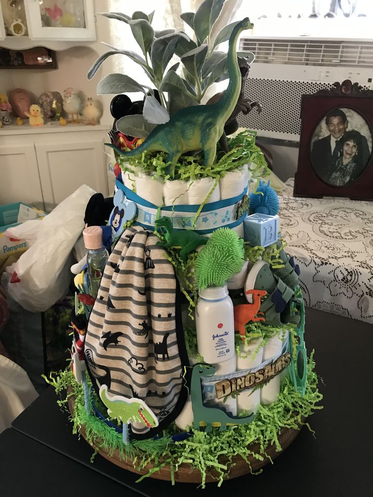 a potted plant sitting on top of a table filled with personal care products and baby items