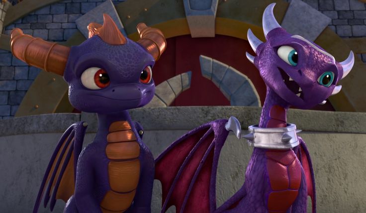 two purple dragon figurines standing next to each other