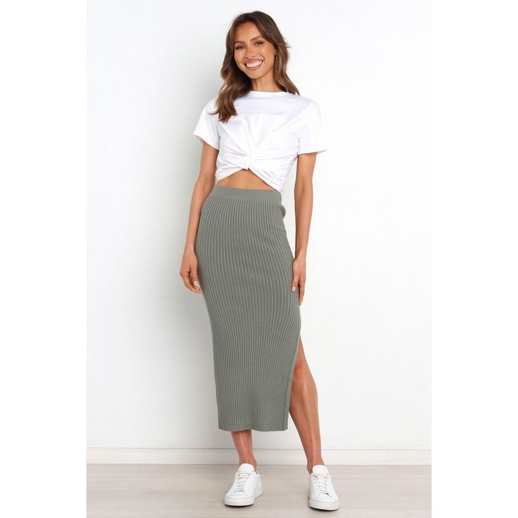 Make a fashion statement in this must-have midi-length skirt! Crafted from stretch ribbed knit for an easy fit, its elasticized waistband ensures maximum comfort and style. With a side split feature to show off your legs, you'll be sure to turn heads when you wear it. Trendy Knit Stretch Skirt, Trendy Stretch Knit Skirt, Knee-length Ribbed Stretch Bottoms, Casual Knee-length Pencil Skirt, Casual Stretch Pencil Skirt For Fall, Relaxed Ribbed Midi Skirt, Fitted Knit Midi-length Bottoms, Fitted Knit Midi Bottoms, Casual Stretch Pencil Skirt For Spring