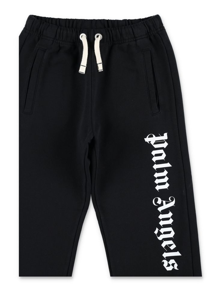 Logo Jogging Pants By Palm Angels. Featuring: Cotton Fabric Relaxed Fit Elastic Waistband With Drawstring Palm Angels Logo On Leg Two Side Pockets Elastic CuffsComposition: 100% cotton Fitted Cotton Pants With Ribbed Cuffs, Spring Cotton Bottoms With Logo Print, Logo Print Cotton Pants For Loungewear, Cotton Logo Print Loungewear Pants, Sporty Cotton Pants With Logo Waistband, Black Cotton Pants With Logo Print, Cotton Loungewear Pants With Logo Print, Casual Cotton Pants With Logo Print, Fitted Cotton Sweatpants With Letter Print