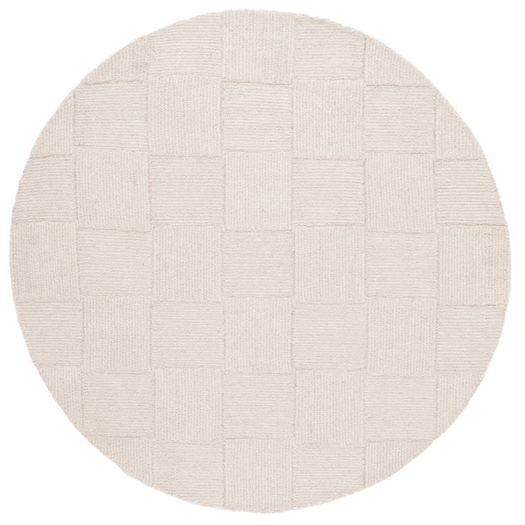 a round rug with white squares on it