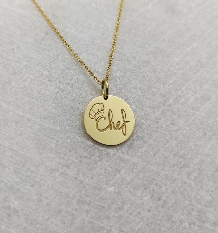 "Chef Necklace - Engraved Chef Charm - Gold Graduation Charm - Gold Cooking Pendant ▪️ A beautiful and clean engraved Chef pendant made out of 14K Solid Real Gold. Available only in yellow gold! Pendant Thickness: 0.65mm Jump Ring inner diameter: 4mm Dimensions - Small - 13x13mm / 0.51 x 0.51 inches Medium - 14x14mm / 0.55 x 0.55 inches Big - 15x15mm / 0.59 x 0.59 inches Necklace Length - You can choose your chain length from 35CM to 50CM. The pendant is available alone without a chain, select \ Gold-tone Medallion Charm Necklace For Gift, Engraved Gold-plated Necklace Gift, Engraved Gold-plated Jewelry Gift, Engraved Gold-plated Necklace For Gift, Personalized Gold-plated Charm Necklaces, Gold-plated 14k Stamped Jewelry Gift, Personalized Gold-plated Pendant Jewelry, Engraved Gold Plated Necklace For Gift, Gold-plated 14k Stamped Pendant Charm Necklace