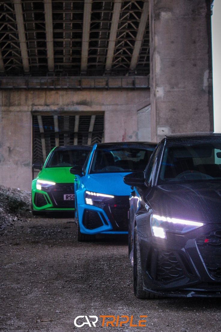 Three performance cars in blue, green, and black parked under a bridge with dramatic lighting. Audi Rs3 Wallpapers, Rs3 Wallpaper, Audi Rs5 Coupe Wallpaper, Audi Rs 3 Sedan, Audi Rs3 Sedan Wallpaper, Rs3 Audi, S3 Audi, Audi Wallpaper, Car Sport