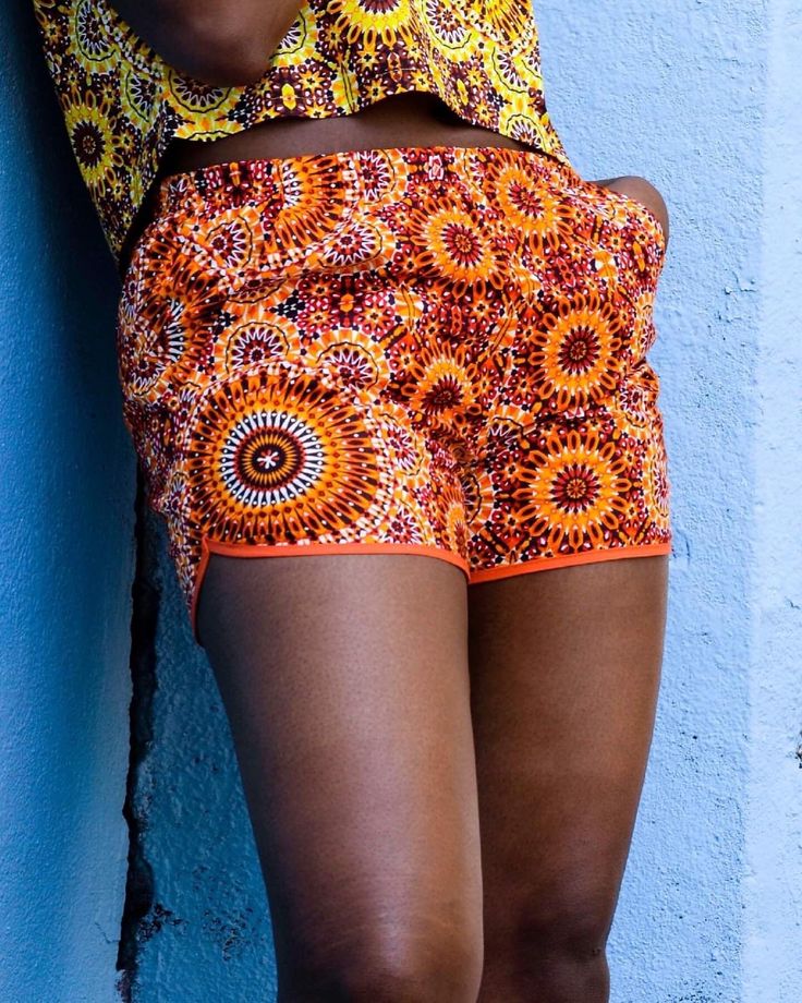 This orange flower vintage print short for women is comfortable to wear. The Yellow flower vintage print crop top for women is enough stretch to wear comfortabely. This elactic waistband shorts is made with african print and cotton woven biais at the edge.  It's perfect fit and style for everyday wear, nightout or when you will rollerskate this summer. Thank top made with cotton and spandex. You can match with a pair of jeans, skirt, pant and obviously the short in the picture. You might want to match the set with a nice turban.  Material: * Short : - 100 % cotton fabric & biais  *Thank top - 65% cotton and 35% spandex Model wear a size M top & bottom.  Sizes charts: Refere to the last listing picture. Thank you for supporting handmade! Care Instructions - This item can be hand washed hung Stretch Floral Print Shorts For Vacation, Stretch Multicolor Floral Print Shorts, Multicolor Stretch Floral Print Shorts, Orange Vacation Shorts With Elastic Waistband, Orange Beachwear Shorts For Spring, Orange Beach Shorts With Elastic Waistband, Orange Relaxed Fit Shorts For Vacation, Printed Fitted Shorts For Vacation, Orange Beachwear Shorts With Elastic Waistband