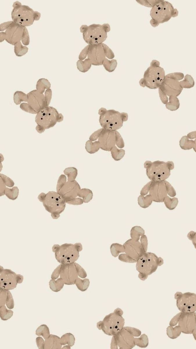 a group of teddy bears sitting next to each other on a white wallpaper background