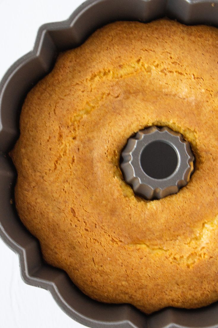 a bundt cake in a round pan with a hole cut into the center and inside