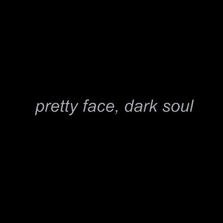 the words pretty face, dark soul written in white on a black background