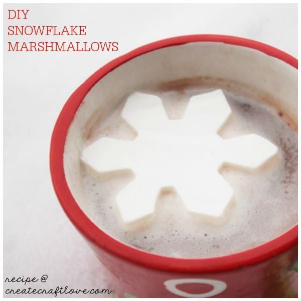 a cup filled with hot chocolate and marshmallows