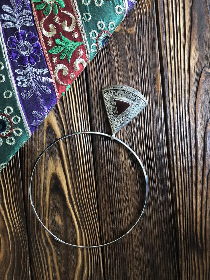 A beaiutiful large boho pendant in an eastern style with a carnelian gemstone. This triangular pendant has a rounded bottom side, which completely changes the feeling of this simple shape. The triangular carnelian in the middle is framed with tender and whimsical metal filigree, that if you look close enough, looks like it has a running doe or a bird in it. This pendant will be perfect for someone who loves fairytales and can think of a magical animal running through the woods while wearing it. Handmade Bohemian Triangle Jewelry, Handmade Triangle Bohemian Jewelry, Bohemian Triangle-shaped Jewelry For Festivals, Bohemian Carnelian Pendant Jewelry, Animal Running, Dramatic Earrings, Everyday Casual Outfits, Mexican Jewelry, Triangle Necklace