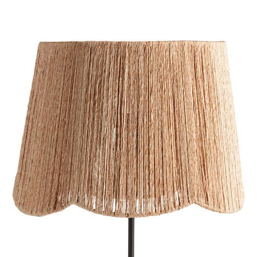 a lamp that is on top of a wooden stand with a light shade over it