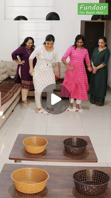 four women standing in a living room with baskets on the floor and bowls on the floor