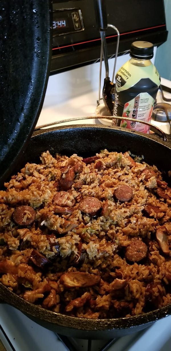 a skillet filled with food sitting on top of a stove next to an oven