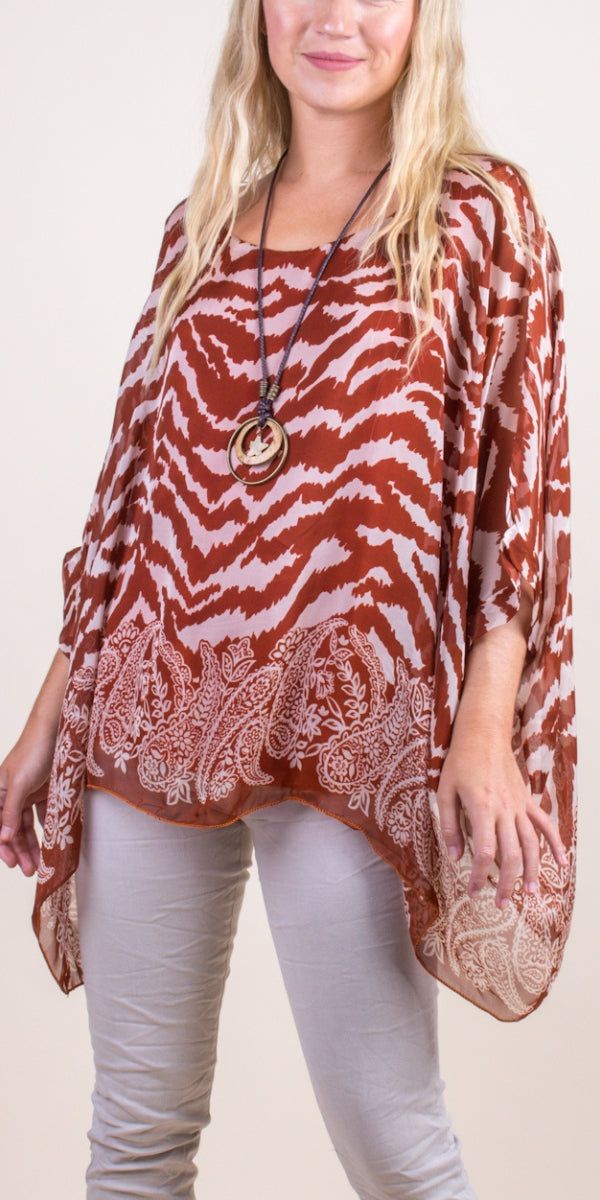 100% Silk Kaftan Style Blouse with Unique Multi-Print Design. Features 3/4 Length Sleeves and a Wavy Bottom. Exterior: 100% Silk Interior: 95% Viscose, 5% Elastic Fits Sizes XS- XL Made in Italy Fall Beach Blouse With 3/4 Sleeves, Bohemian Flowy Tops With 3/4 Sleeves, Flowy Brown Blouse For Summer, Beach Printed Brown Blouse, Beach Blouse With Brown Print, Kaftan Style, Silk Kaftan, Style Blouse, New Bag