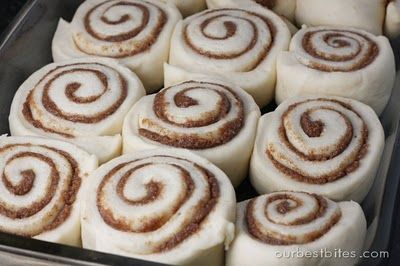 there are many cinnamon rolls in the pan