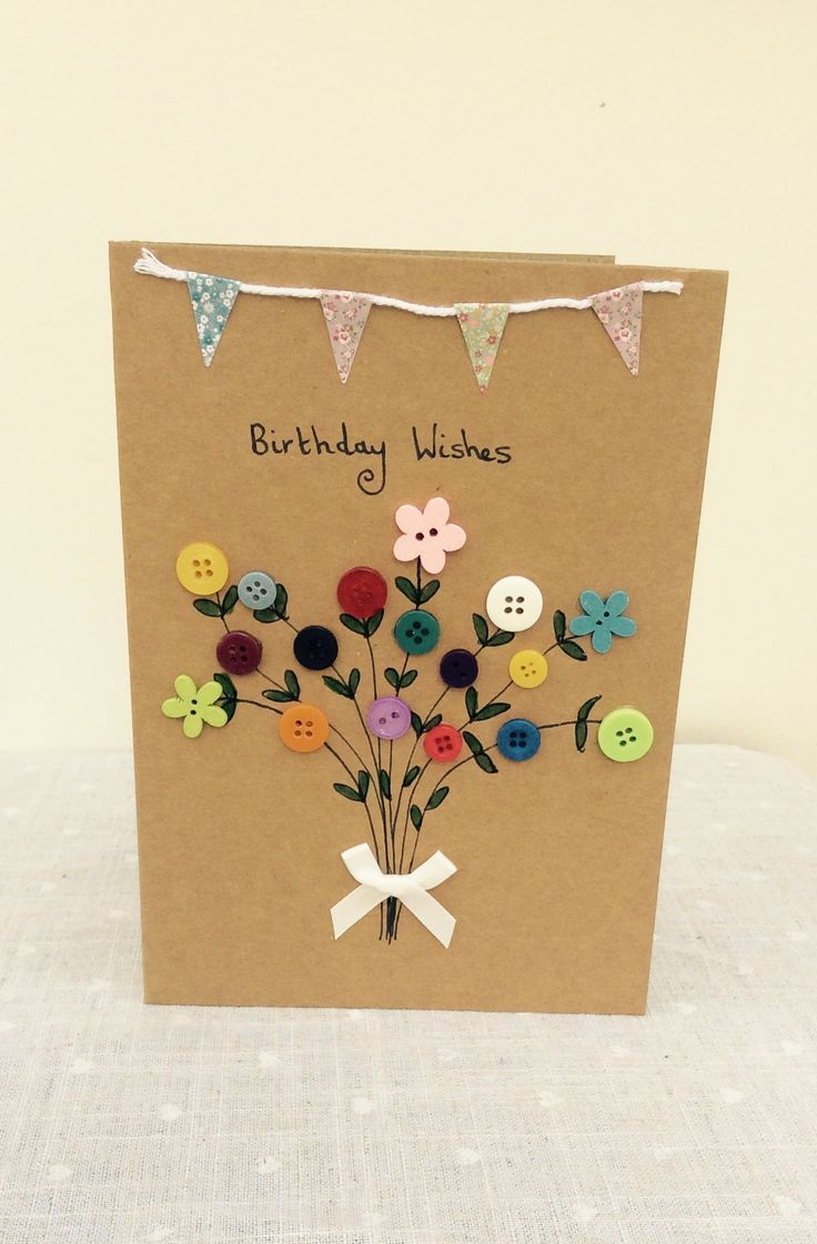 a birthday card with buttons and flowers on it