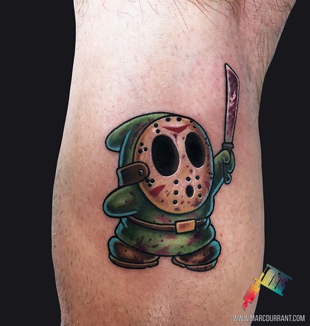 a tattoo with a cartoon character holding a knife