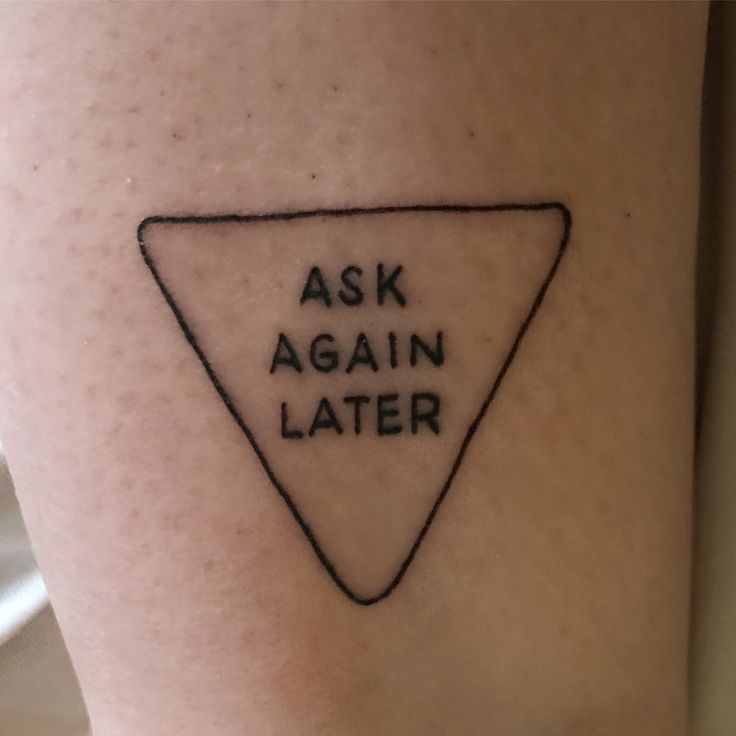 a tattoo with the words ask again later on it