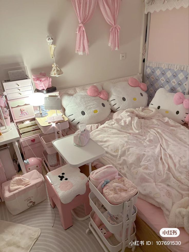 a bedroom with hello kitty decorations on the walls