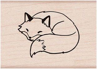 a rubber stamp with an image of a sleeping fox