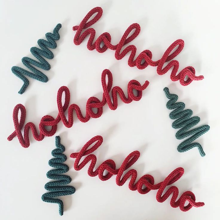 red and green christmas decorations with the word hohoho in cursive writing