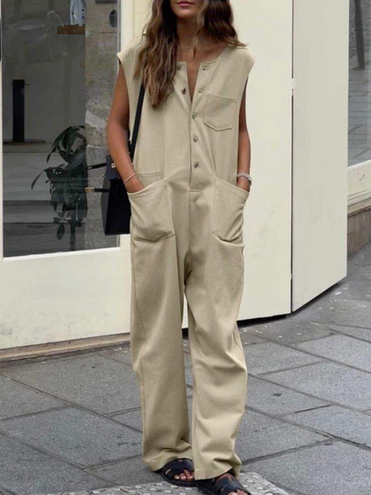 When it comes to being comfortable, light and beautiful, Jumpsuits are the ideal garment for that relaxed and cool style that you want to project. It is versatile, easy and quick to combine, it stylizes the body and can be used by any woman of any age. This practical beige jumpsuit is perfect for you, it will give you a unique casual style. It features a sleeveless. Front and back pockets. V- neckline. Cotton. Buttons down front closure. Color may be lighter or darker depending of the device it Relaxed Spring Jumpsuits And Rompers, Casual Cotton Sleeveless Jumpsuits And Rompers, Casual Sleeveless Cotton Jumpsuits And Rompers, Sleeveless Cotton Jumpsuit For Leisure, Sleeveless Cotton Jumpsuits And Rompers For Leisure, Comfortable Summer Overalls And Rompers, Comfortable Jumpsuits And Rompers For Summer Leisure, Comfortable Summer Jumpsuits And Rompers For Leisure, Summer Jumpsuits And Rompers For Leisure