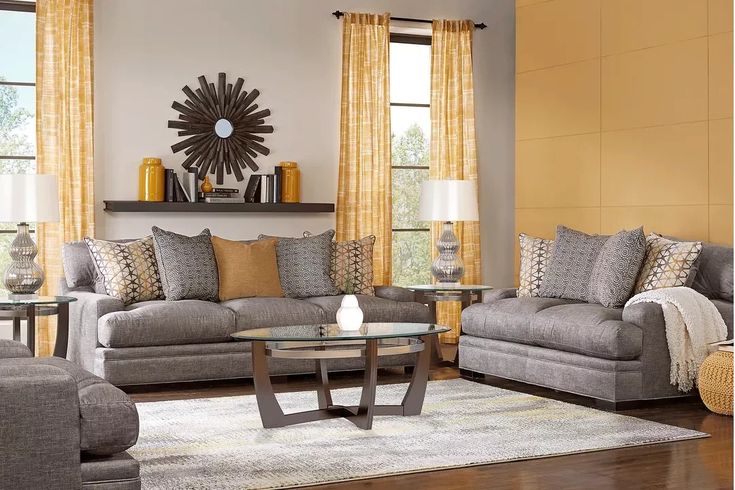 a living room filled with furniture and yellow curtains