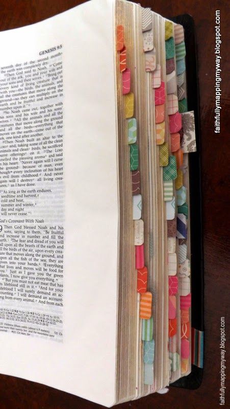 an open book with many different colored beads on it's cover and pages folded in half