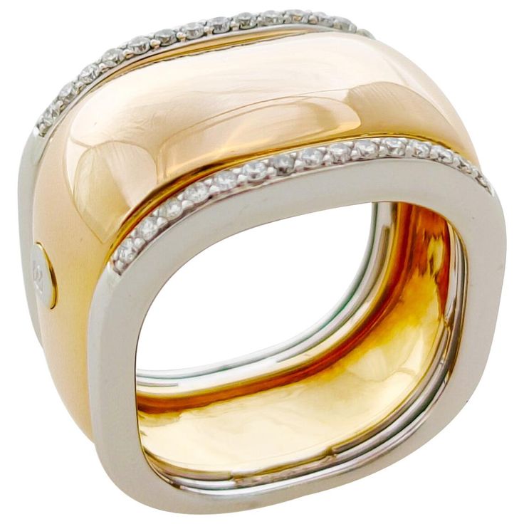 This comfortable ring has a square profile which makes this ring by Italian designer Centoventuno a modern elegant statement with a flair of masculinity for a modern, androgynous aesthetic. The ring is made in 18 karat rose gold. This 14mm wide ring is bordered on either side by a line of brilliant cut diamonds set in white gold. Total weight of diamonds is 0.22 carat. This Italian design ring is a European size 53 which is a US size 6.5 This ring is in new condition and will be send beautifully packed. Androgynous Aesthetic, Square Ring, Wide Ring, Design Square, Wide Rings, Square Rings, Italian Designer, Family Heirloom, Brilliant Cut Diamond